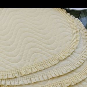 A set of 4 Vintage Oval Light Yellow Placemats